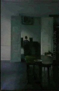 An Interior With A Woman Playing The Piano by Vilhelm Hammershoi
