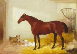 A Bay Hunter With Two Terriers In A Loose Box