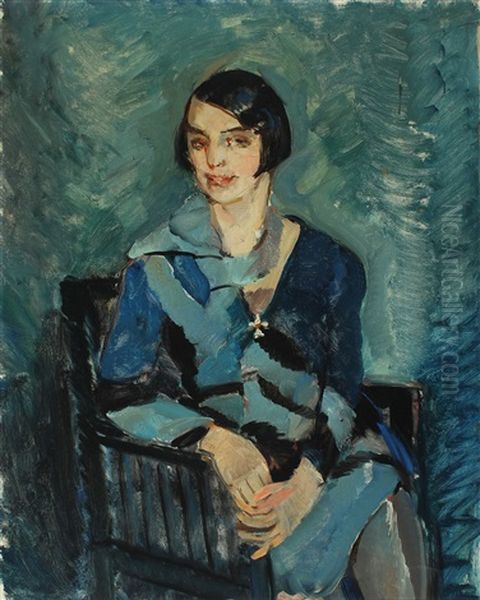 Woman In A Blue Dress Sitting In A Chair - view 1