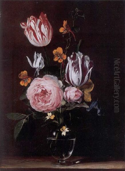 Roses, Tulips, Primroses And Other Flowers In A Glass Vase, On A Wooden Table - view 1