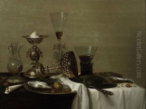 A Silver Cup With A Roemer Of White Wine And A Glass Jug On A Draped Table With A Pewter Dish Of Oysters And Nuts by Willem Claesz Heda