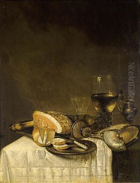 A Still Life With A Nautilus Cup, A Roemer, A Wineglass, A Ham, Bread And A Knife On Pewter Plates Together With A Silver Gilt Mustard Jar, All On A Table Draped With A White Tablecloth - view 1