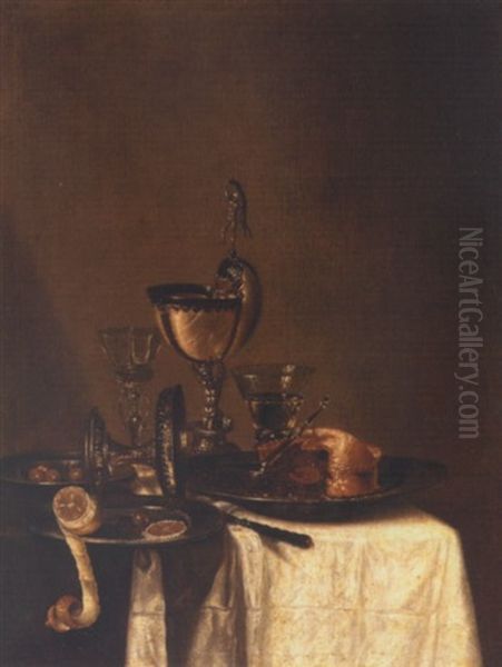 Still Life Of A Nautilus Cup, An Overturned Tazza, A Partially Eaten Pie In A Pewter Bowl And A Knife, Together With Two Wine Glasses, Olives And A Peeled Lemon, Upon A Draped Table Top - view 1