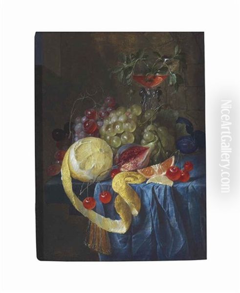 A Partly-peeled Lemon, Fig, Slice Of Orange, Cherries, Plums And Bunches Of Grapes With A Facon De Venise Wine Glass On A Draped Stone Ledge - view 1