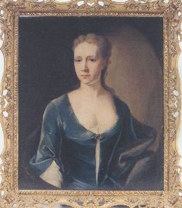 Portrait Of A Lady Seated, Wearing A Green Velvet Dress With A Brooch At Her Breast And A Jewel At Her Cuff