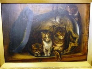 Cat And Three Kittens Beside A Hatbox