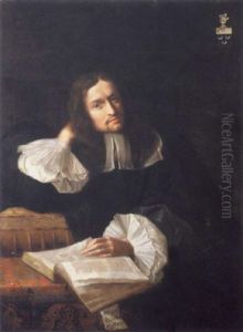 Homme De Qualite Assis A Sa Table De Travail La Main Gauche Posee Sur Un Livre Ouvert