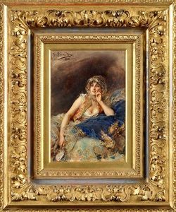 A Spanish Beauty Reclining On A Couch by Daniel Hernandez Morillo