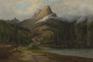 Riders With Pack Horses In A Mountain Landscape