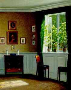 A Sunlit Interior With Plants On The Windowsill
