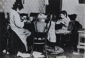 Picking Nuts In A Basement Tenement Ages 4-6-9 by Lewis W. Hine