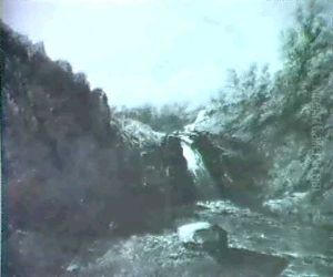 A Rocky River Landscape With Anglers On A Bank