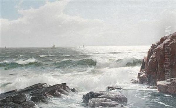 A Rocky Shoreline With Yachts In The Distance - view 1