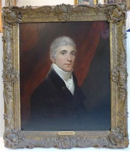 A Head And Shoulders Portrait Of John Browne Of Salperton Park, Gloucester, Depicted In A Wine Coloured Jacket Before A Red Curtain by Sir John Hoppner