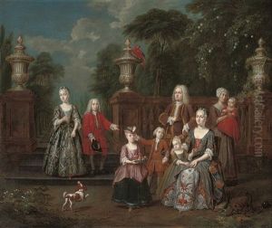 A Group Portrait Of An Elegant Family In A Formal Garden