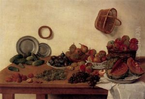 A Kitchen Still Life With Various Fruits And Baskets And On Porcelain Plates, Two Pewter Plates, Nuts And Other Objects, All On A Wooden Table