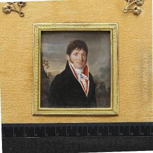 A Gentleman, Wearing Black Overcoat, White Coat, Red Waistcoat, Frilled White Chemise And Tied Stock, Landscape Background With Classical Folly.