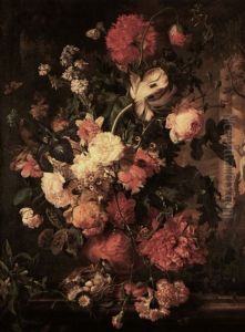 Flowers In A Terracotta Vase Decorated With Putti & Garlandson Marble Plinth With 3 Eggs. Garden With Female With Wreath