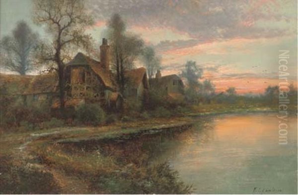 A Thatched House Beside A Lake At Sunset - view 1