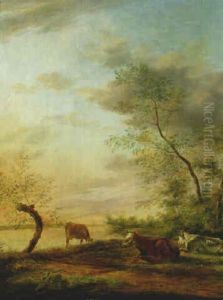 Cattle Grazing On A River Bank