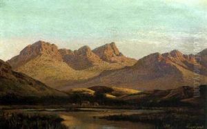 Cottages At A Lake Beneath The Mountains