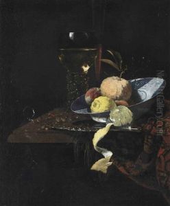 A Roemer, A Glass Flute, An Orange, Two Peaches And A Lemon In A Blue And White Wanli Kraak Charger With A Knife And A Partially Peeled Lemon... by Willem Kalf