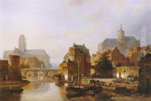 A Town Along A River With Moored Shipping And Figures       Unloading A Flat, Churches Beyond