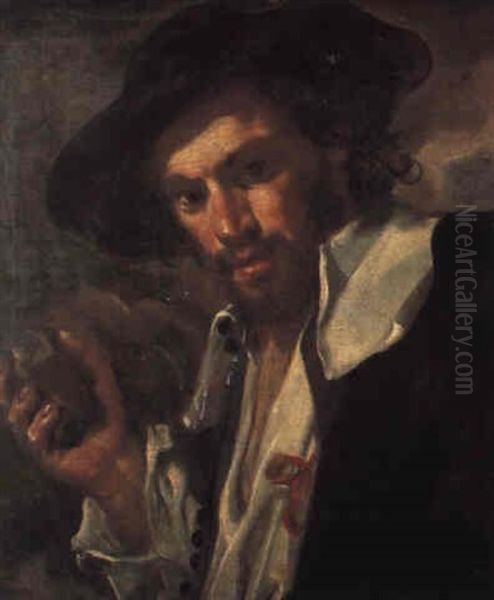 A Man, Bust Length, In A Black Hat, Holding A Stone - view 1