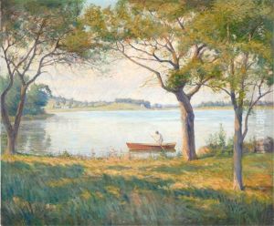 A Lone Boater On A Tree-lined Pond