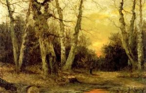 Sunset Over A Wooded Landscape With A Figure On A Path