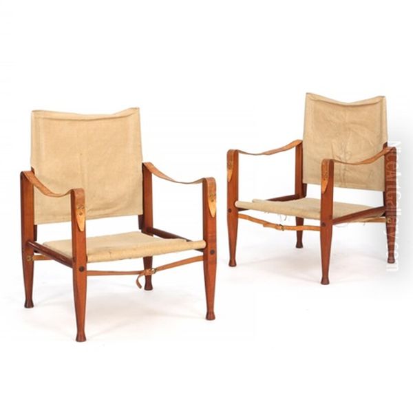 A Pair Of Safari Chairs With Stained Ash Frame - view 1