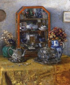 A Collection Of Ornaments In A Glass Case On A Table A Collection Of Ornaments In A Glass Case On A Table