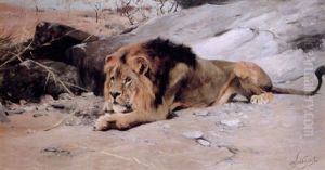 Lion Reclining In A Rocky Landscape by Wilhelm Friedrich Kuhnert