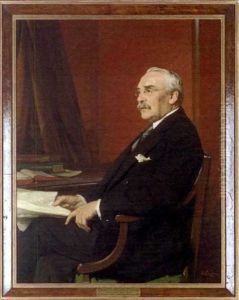 Portrait Of Sir Gerald Hemmington Ryan, Bt., Seated At A Desk