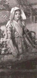 Three-quarter Length Portrait Of A Girl Carrying A Basket Of Flowers by John Lochhead