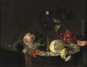 A Roemer With White Wine, A Partially Peeled Lemon, Cherries And Other Fruit On A Silver Plate With A Rose And Grapes On A Stone Ledge
