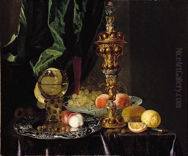 A Still Life Of Peaches, Grapes, A Lemon, A Segment Of Orange, Hazelnuts And A Bread Roll, Together With A Roemer, A Large Gold Pronckblokaal And A Silver Platter, All Laid Out On A Draped Table - view 1