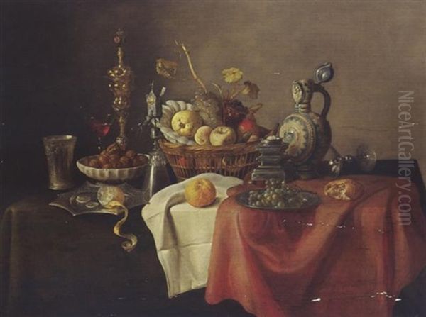 A Sumptuous Still Life With A Silver-giltbeaker, A Lemon, Walnuts, A Cup, A Glass, Fruit In A Basket, And Bread On A Draped Table - view 1