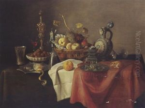 A Sumptuous Still Life With A Silver-giltbeaker, A Lemon, Walnuts, A Cup, A Glass, Fruit In A Basket, And Bread On A Draped Table by Cornelis Mahu