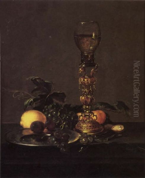 A Roemer Of White Wine On An Elaborate Stand With Black Grapes And Plums On A Pewter Plate, A Lemon, White Grapes, Peaches, Nuts And Berries - view 1