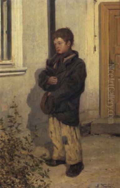 A Young Boy Clutching His Jacket And Hat - view 1