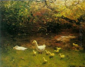 A Duck With Ducklings On The Waterfront