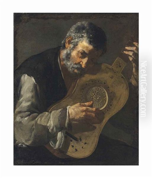 A Man Playing The Guitar - view 1