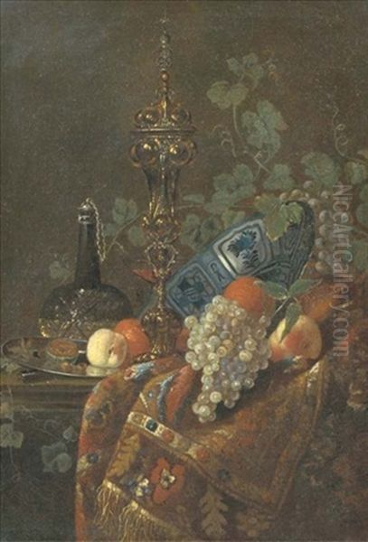 Oranges In A Wanli Kraak Porselein Bowl, A Peach And Nuts On A Silver Plate, A Glass Vessel Of Wine, A Gilt Cup And Cover And White And Black Grapes, All On A Partially Draped Table - view 1