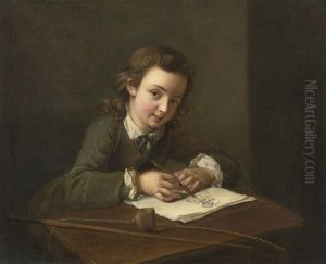 A Boy Drawing At His Desk