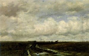 An Extensive Polderlandscape With A Farmer Ploughing