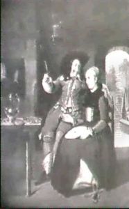 An Interior With A Gentleman Drinking And A Lady Sewing by Gabriel Metsu