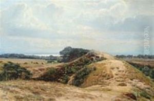 Landscape With View Towards The Sea And Cows Grazing In A Field