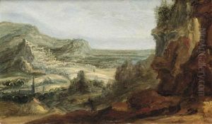 An Extensive Mountainous Landscape With A Town In The Distance by Philips de Momper the Elder