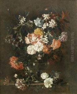Poppies, Honeysuckle, Chrysanthemums And Other Flowers In A Glass Vase On A Stone Ledge